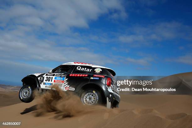 Nasser Al-Attiyah of Qatar and Lucas Cruz of Spain for MINI compete in stage 10 on the way to Antofagasta during Day 11 of the 2014 Dakar Rally on...