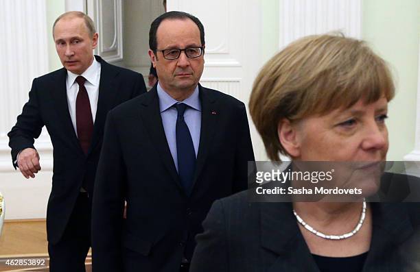 Russian President Vladimir Putin attends a meeting with German Chancellor Angela Merkel and French President Francois Hollande on February 6, 2015 in...