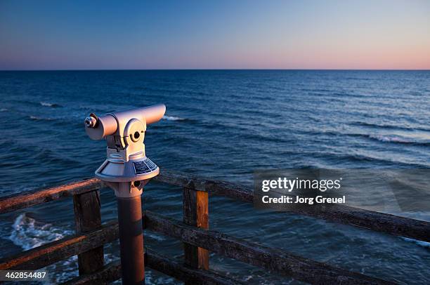 telescope and baltic sea at sunrise - binoculars german stock pictures, royalty-free photos & images