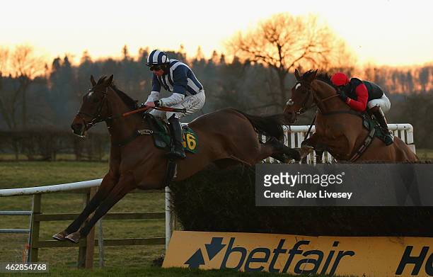 Teaforthree ridden by J.J Codd clears the last fence on their way to victory in the Bet On Your Mobile At Corbettsports Open Hunters' Steeple Chase...