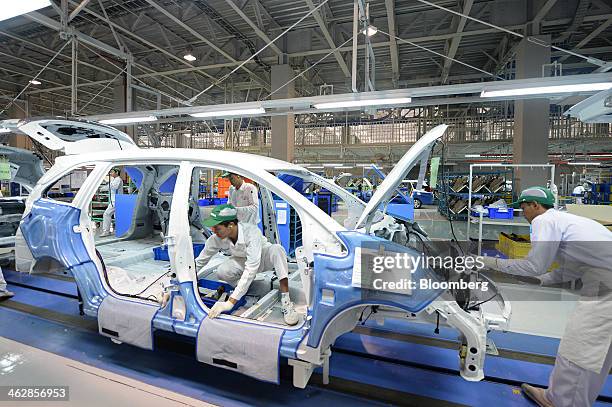 Employees assemble the Honda Motor Co. Mobilio multi-purpose vehicle at the PT Honda Prospect Motor factory in Karawang, Indonesia, on Wednesday,...