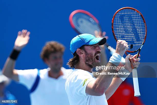 Christopher Kas of Germany and Robin Haase of the Netherlands celebrate winning a point in their first round doubles match against Nikolay Davydenko...