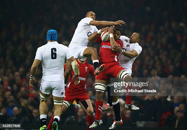 Toby Faletau of Wales catches the ball with Jonathan Joseph and Luther Burrell of England during the RBS Six Nations match between Wales and England...