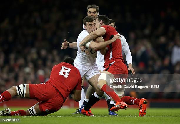 George Ford of England is tackled by Toby Faletau of Wales and Sam Warburton of Wales during the RBS Six Nations match between Wales and England at...