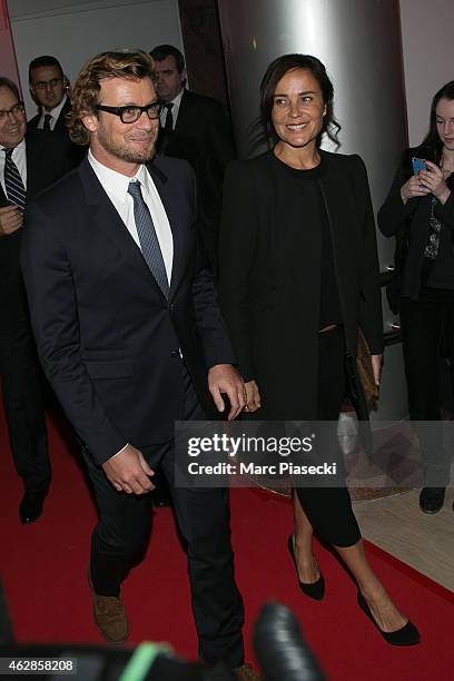 Actor Simon Baker and wife Rebecca Riggs arrive to attend the 'MENTALIST' photocall at TF1 TV studios on February 6, 2015 in Paris, France.