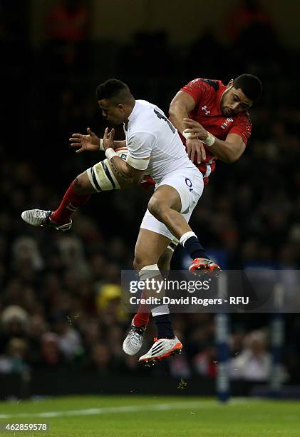 Anthony Watson of England caims a high ball under pressure from Toby Faletau of Wales during the RBS Six Nations match between Wales and England at...