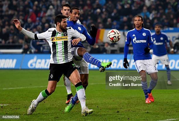 Alvaro Dominguez of Borussia Moenchengladbach challenges Joel Matip of Schalke 04 during the Bundesliga match between FC Schalke 04 and Borussia...