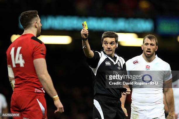 Referee Jerome Garces of France shows the yellow card to Alex Cuthbert of Wales during the RBS Six Nations match between Wales and England at the...