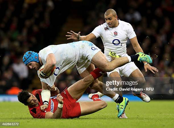 James Haskell of England is hauled down by Mike Phillips of Wales during the RBS Six Nations match between Wales and England at the Millennium...