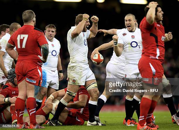 Captain Chris Robshaw of England and Mike Brown of England celebrate their team's 21-16 victory as the final whistle blows during the RBS Six Nations...