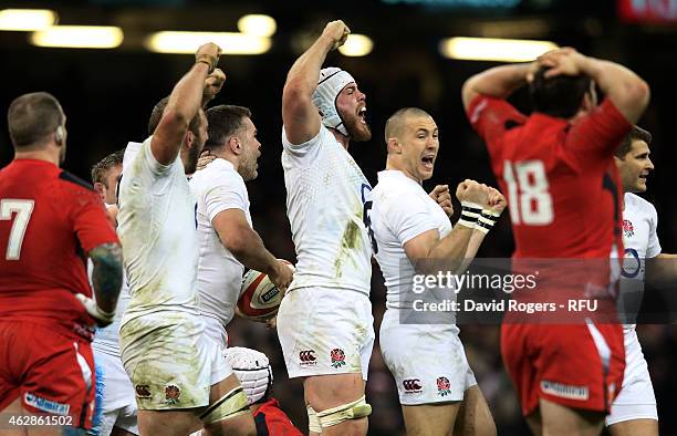 Dave Attwood of England and his teammates celebrate their team's 21-16 victory as the final whistle blows during the RBS Six Nations match between...