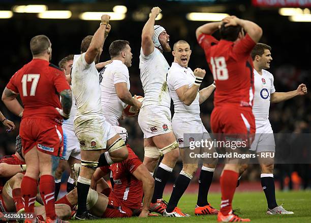Dave Attwood of England and his teammates celebrate their team's 21-16 victory as the final whistle blows during the RBS Six Nations match between...
