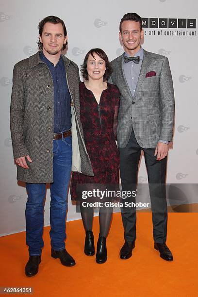 Felix Klare, Eva Loebau, Vladimir Burlakov attend the premiere of the film 'Der Clan. Die Geschichte der Familie Wagner' at Gloria Palast on January...