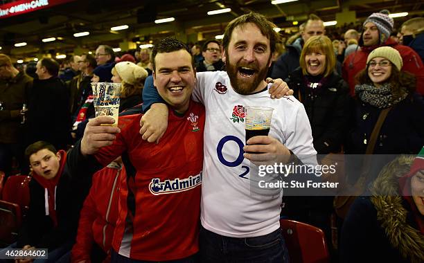 Rival fans enjoy a drink together before the RBS Six Nations match between Wales and England at Millenium Stadium on February 6, 2015 in Cardiff,...