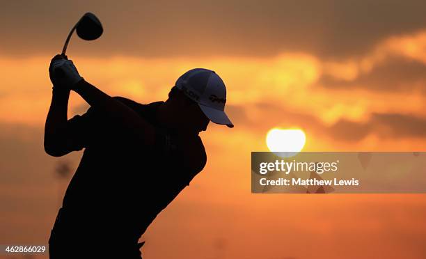 Michael Campbell of New Zealand warms up on the driving range ahead of day one of the Abu Dhabi HSBC Golf Championship at Abu Dhabi Golf Club on...