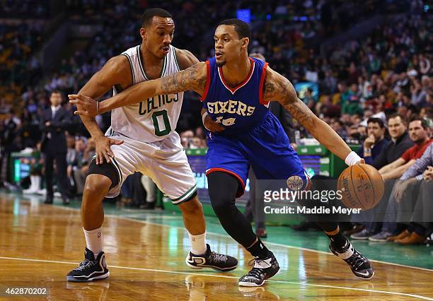 McDaniels of the Philadelphia 76ers drives against Avery Bradley of the Boston Celtics during the second quarter at TD Garden on February 6, 2015 in...