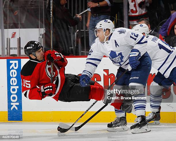 Tuomo Ruutu of the New Jersey Devils is hit by Stephane Robidas of the Toronto Maple Leafs during the second period at the Prudential Center on...