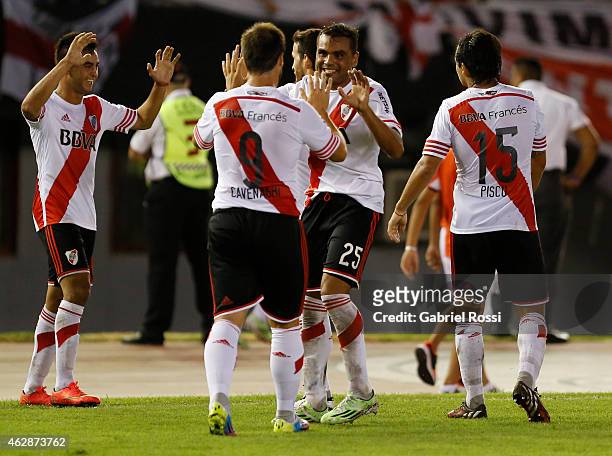 Gabriel Mercado and Fernando Cavenaghi of River Plate Plate celebrate after teammate Carlos Sanchez scored the first and winning goal of the team...