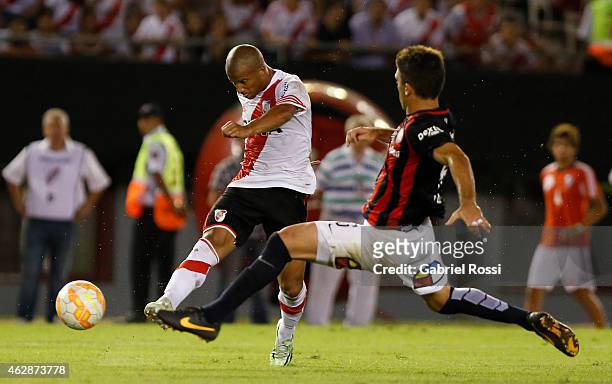 Carlos Sanchez of River Plate Plate kicks the ball to score the first goal during a first leg match between River Plate Plate and San Lorenzo as part...