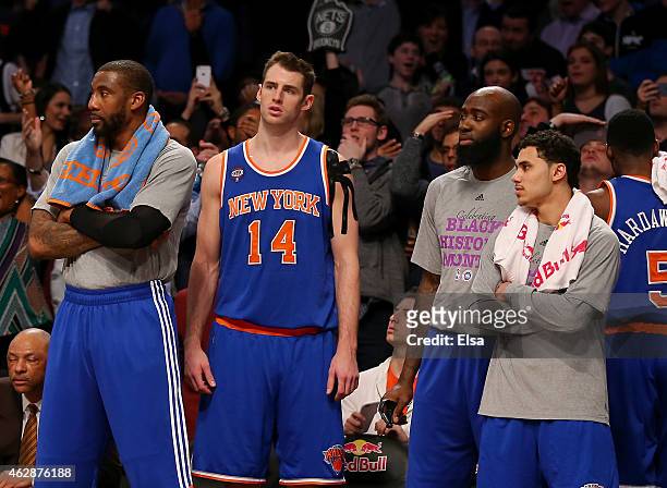 Amar'e Stoudemire,Jason Smith,Quincy Acy and Shane Larkin of the New York Knicks react after Alan Anderson of the Brooklyn Nets hit a three point...