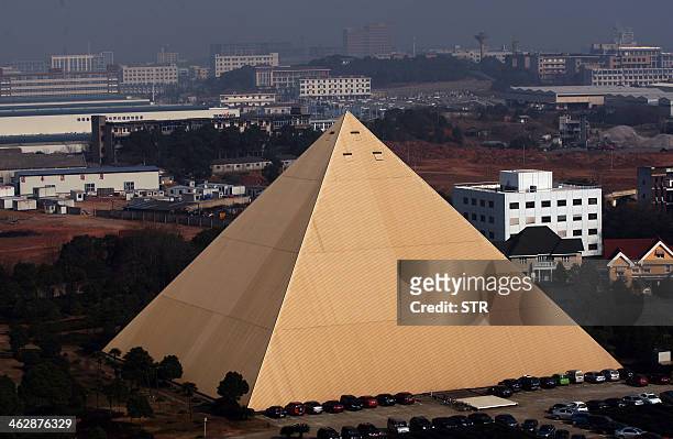 China-environment-construction-architecture,FEATURE by Tom HANCOCK This picture taken on December 31 shows a 130-foot high pyramid built by Chinese...