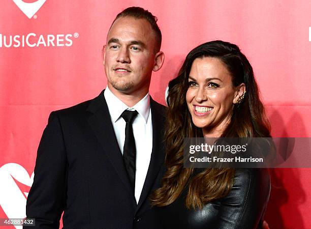 Singer Alanis Morissette and Mario Treadway attend the 25th anniversary MusiCares 2015 Person Of The Year Gala honoring Bob Dylan at the Los Angeles...