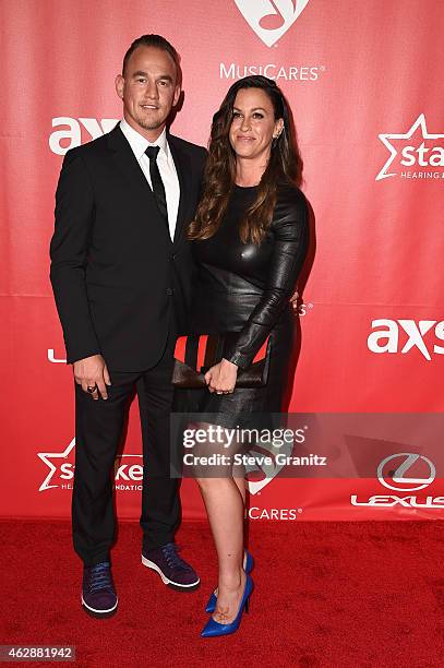 Recording artists Mario Treadway and Alanis Morissette attend the 25th anniversary MusiCares 2015 Person Of The Year Gala honoring Bob Dylan at the...