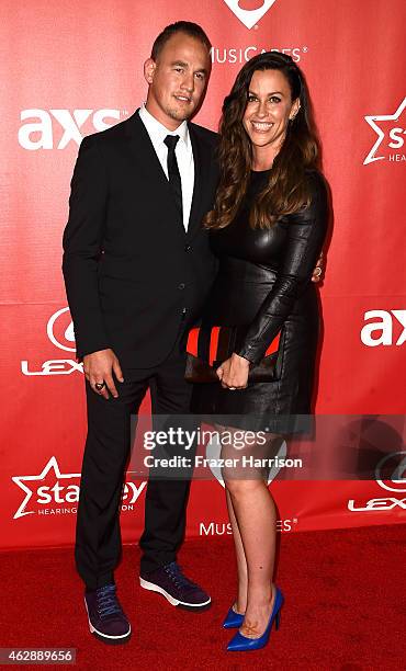 Singer Alanis Morissette and Mario Treadway attend the 25th anniversary MusiCares 2015 Person Of The Year Gala honoring Bob Dylan at the Los Angeles...