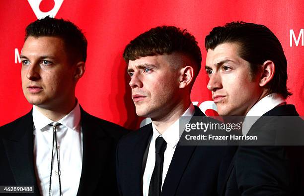 Musicians Matt Helders, Jamie Cook, and Alex Turner of Arctic Monkeys attend the 25th anniversary MusiCares 2015 Person Of The Year Gala honoring Bob...