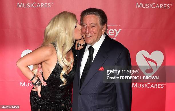 Lady Gaga and Tony Bennett pose on their red carpet arrival for the 2015 MusiCares Person of the Year annual benefit gala dinner and concert in Los...