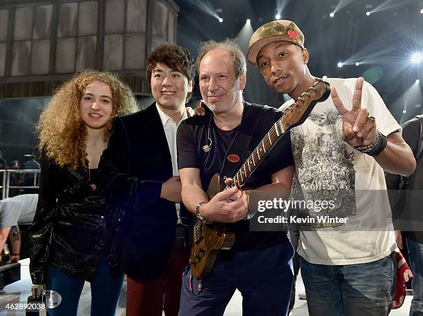 Musicians Tal Wilkenfeld, Lang Lang, Hans Zimmer and Pharrell Williams pose backstage during The 57th Annual GRAMMY Awards at the Staples Center on...