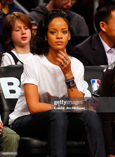 Singer Rihanna attends an NBA game between the Brooklyn Nets and the Miami Heat at Barclays Center on January 10, 2014 in the Brooklyn borough of New...