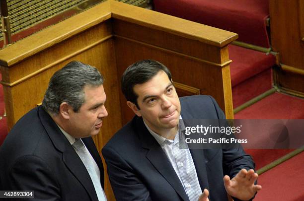 Greek Prime Minister Alexis Tsipras talks with Minister of Defence Panos Kamenos.Greek Lawmaker's voted for the president of the Newly elected Greek...