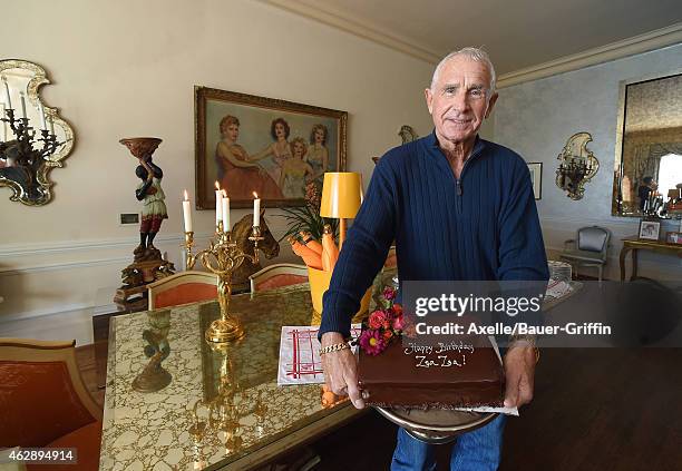 Frederic Prinz von Anhalt poses with the birthday cake during the press conference for Zsa Zsa Gabor's 98th Birthday at Zsa Zsa's Bel Air mansion on...