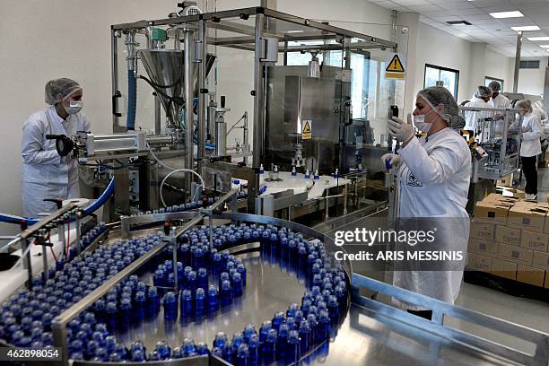 Employees of the Apivita ecological cosmetic company pack products at the company workshops in Markopoulo, south of Athens, on February 2, 2015....