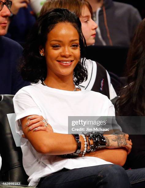 Singer Rihanna attends an NBA game between the Brooklyn Nets and the Miami Heat at Barclays Center on January 10, 2014 in the Brooklyn borough of New...