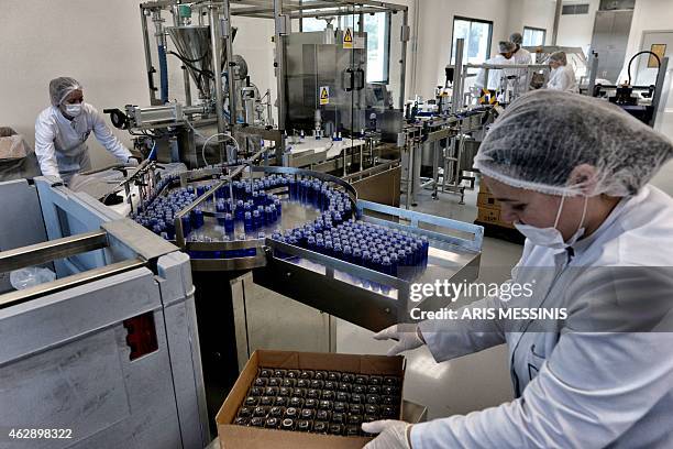 Employees of the Apivita ecological cosmetic company pack products at the company workshops in Markopoulo, south of Athens, on February 2, 2015....