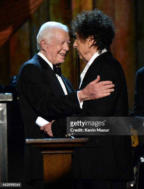 Former United States President Jimmy Carter and Bob Dylan onstage at the 25th anniversary MusiCares 2015 Person Of The Year Gala honoring Bob Dylan...