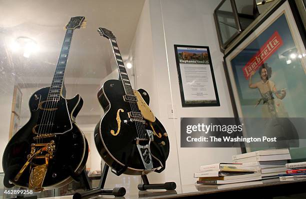 Les Paul's 1954 black solid body custom guitar, "Black Beauty," and Chet Atkins's 1956 Gretsch black sealed top 6120 prototype, "Dark Eyes," seen at...