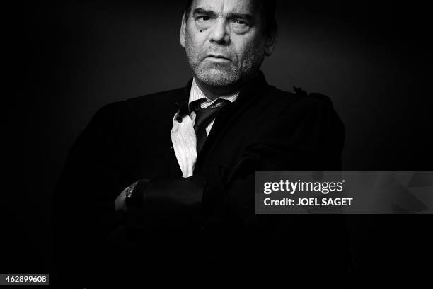 French lawyer Frank Berton poses in a photo studio in Paris on February 3, 2015 in Paris. Version black & white AFP PHOTO JOEL SAGET