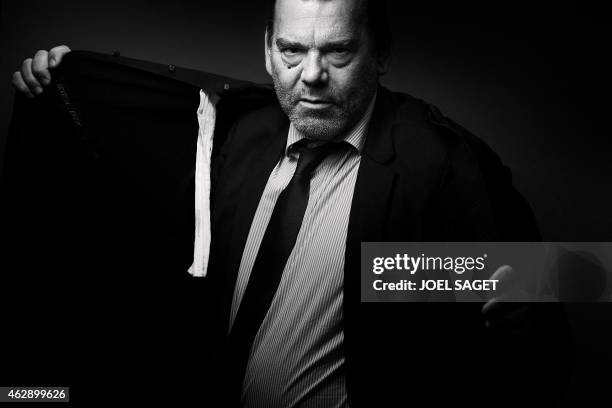 French lawyer Frank Berton poses in a photo studio in Paris on February 3, 2015 in Paris. Version black & white AFP PHOTO JOEL SAGET