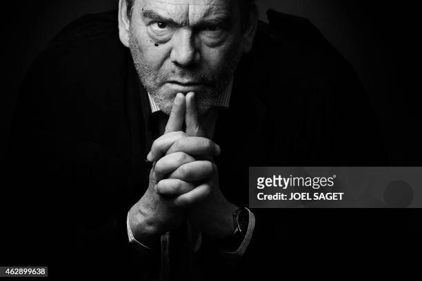 French lawyer Frank Berton poses in a photo studio in Paris on February 3, 2015 in Paris. Version black & white AFP PHOTO JOEL SAGET
