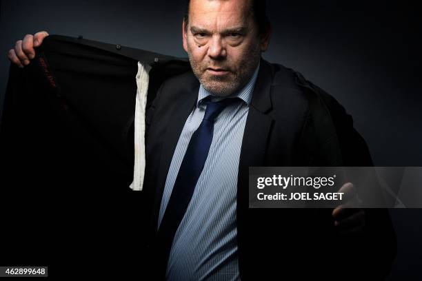 French lawyer Frank Berton poses in a photo studio in Paris on February 3, 2015 in Paris. AFP PHOTO JOEL SAGET