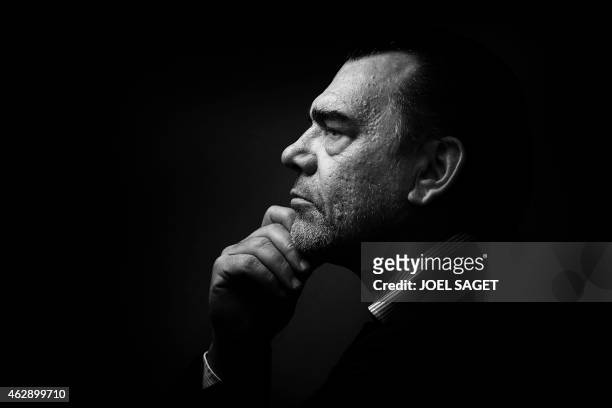 French lawyer Frank Berton poses in a photo studio in Paris on February 3, 2015 in Paris. Version black & white AFP PHOTO JOEL SAGET