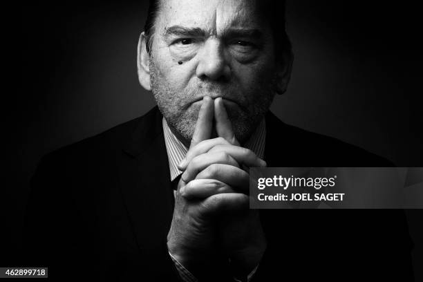 French lawyer Frank Berton poses in a photo studio in Paris on February 3, 2015 in Paris. Version black & white AFP PHOTO JOEL SAGET