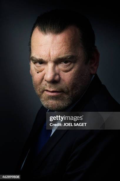 French lawyer Frank Berton poses in a photo studio in Paris on February 3, 2015 in Paris. AFP PHOTO JOEL SAGET