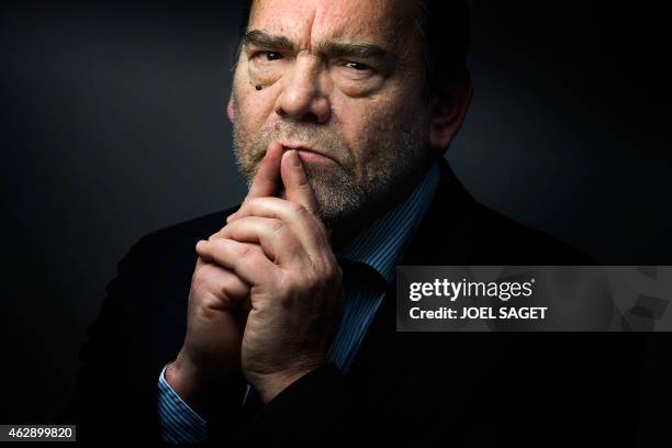 French lawyer Frank Berton poses in a photo studio in Paris on February 3, 2015 in Paris. AFP PHOTO JOEL SAGET