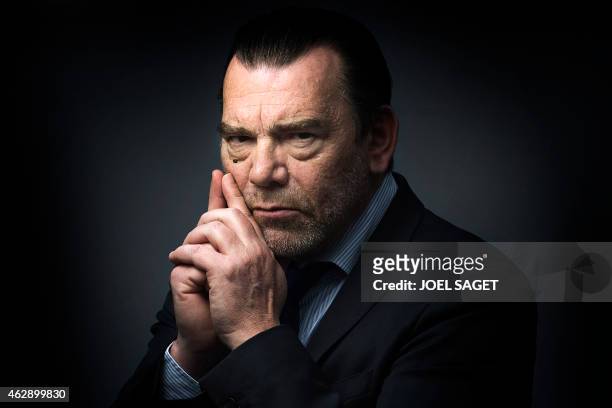 French lawyer Frank Berton poses in a photo studio in Paris on February 3, 2015 in Paris. AFP PHOTO JOEL SAGET