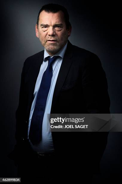 French lawyer Frank Berton poses in a photo studio in Paris on February 3, 2015 in Paris. AFP PHOTO JOEL SAGET