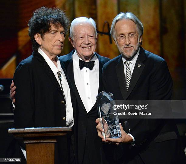 Bob Dylan, Former United States President Jimmy Carter and National Academy of Recording Arts and Sciences President Neil Portnow speaks onstage at...